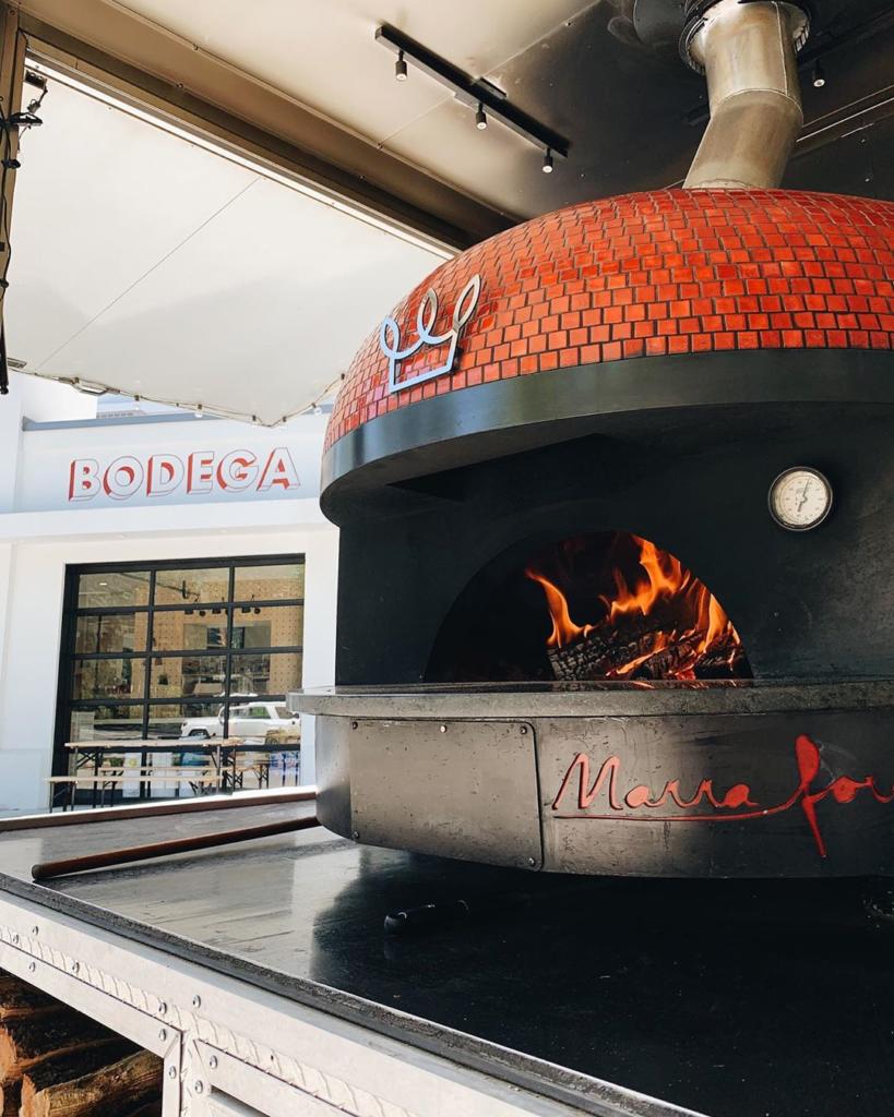 Red mobile brick oven from Big Bon Pizza and Marra Forni oven