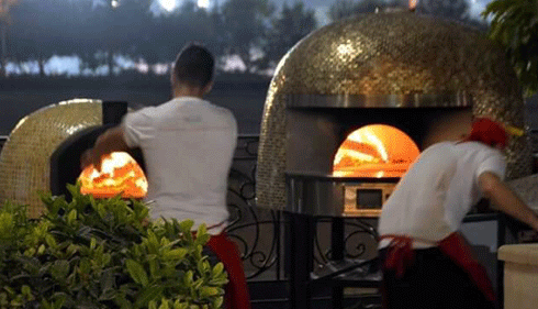 Chefs In Dubai Cook Pizzas in yellow Marra Forni Capri and Neapoitan Brick Ovens