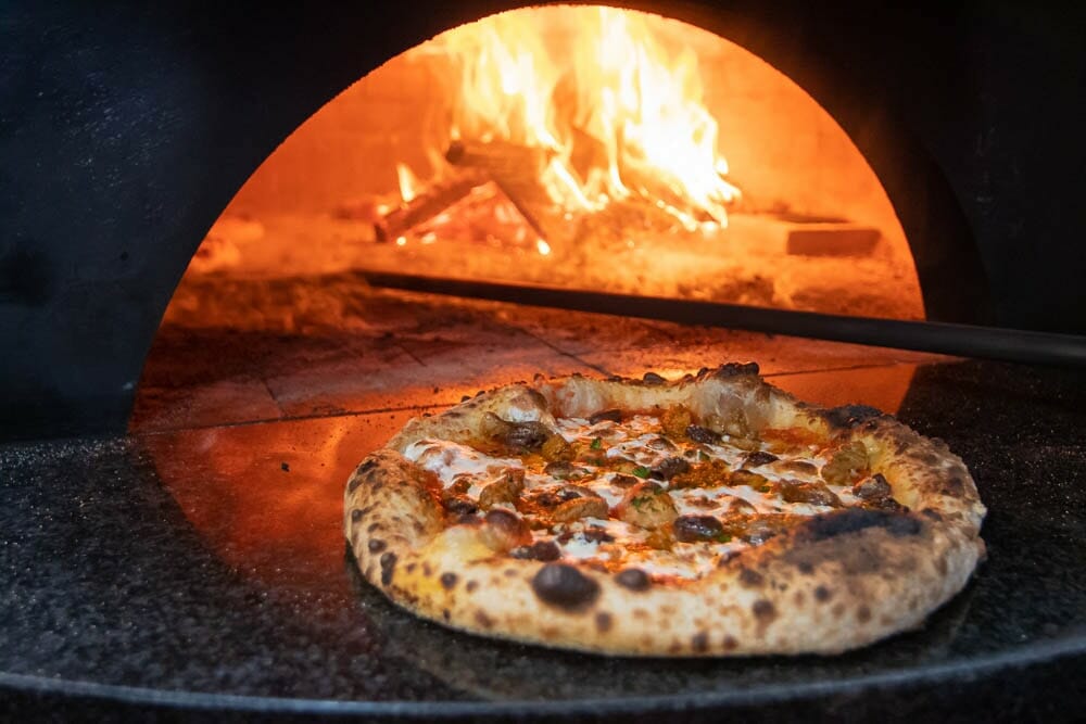 Sausage Mozzarella Cheese Pizza By a Wood Fired Brick Oven