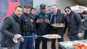 Marra Forni Brothers serve freshly cooked pepperoni and cheese pizza to Washington DC police officers