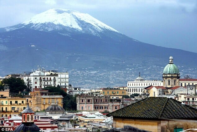 Mount Vesuvius overlooking the buildings in the city of Naples in Italy