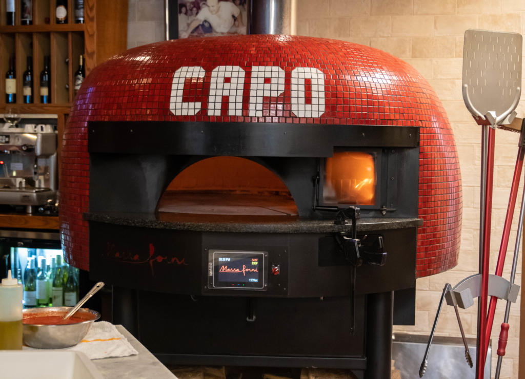Red Tiled Brick Oven spelling out CAPO by Marra Forni