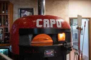 Marra Forni Wood and Gas Fired Rotator Oven with venting and Red tiles in La Posta Pizzeria